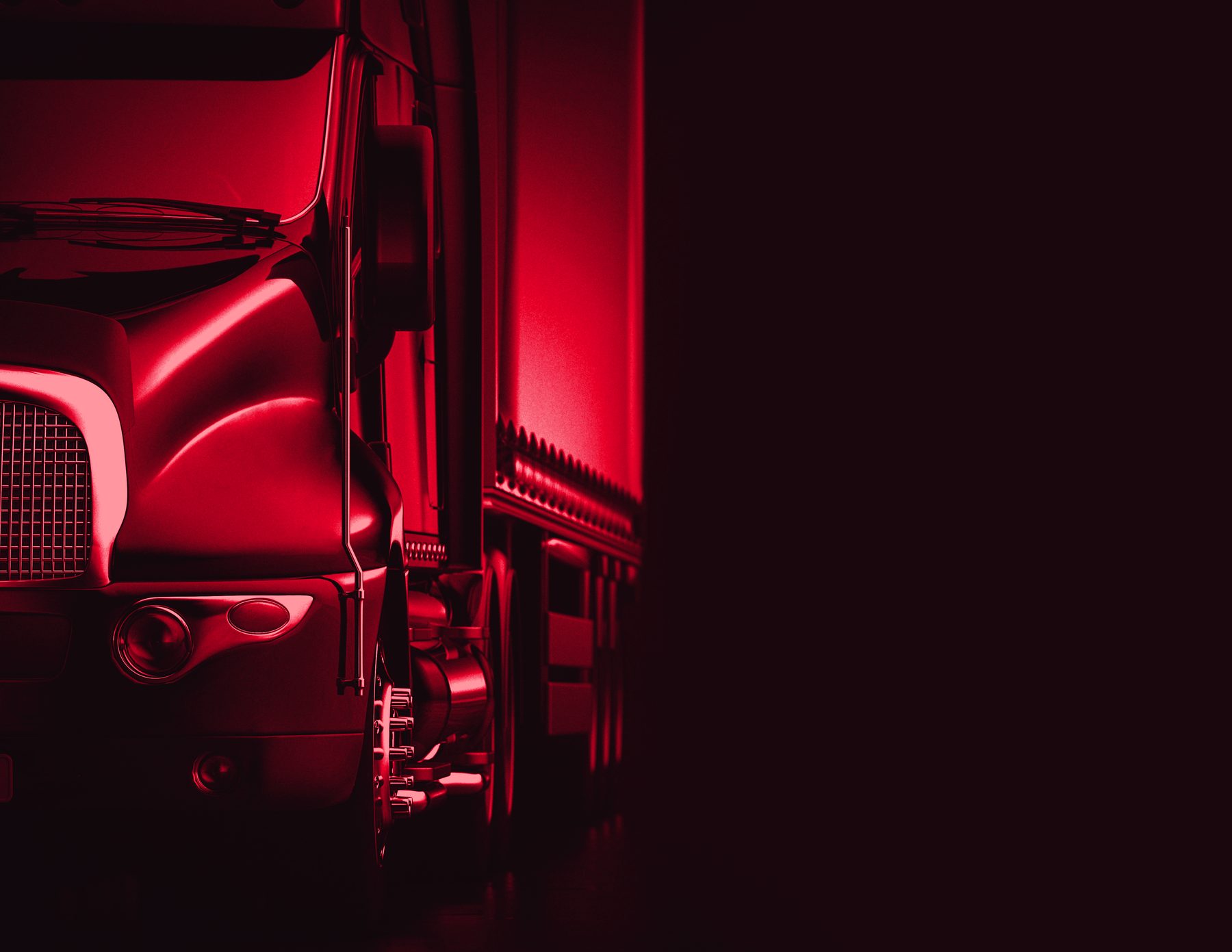 Frente de un tractocamión en penumbra, en duotono rojo